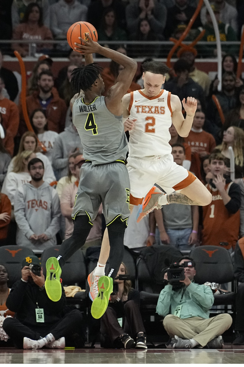 Jan 20, 2024; Austin, Texas, USA; Baylor Bears guard Ja'Kobe Walter (4) shoots over guard Chendall Weaver (2) during the first half at Moody Center. Mandatory Credit: Scott Wachter-USA TODAY Sports